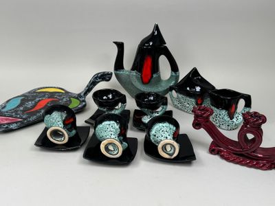 many pieces of art that are sitting on a table