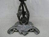 a metal table with a bird on top of it