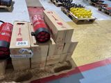 several boxes of fire extinguisors are stacked on a pallet in a warehouse