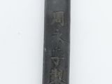 a black and gold lighter with a lion head on it