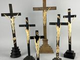 three crucifixs of jesus and a cross on a stand