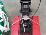 a red machine that is sitting on the floor