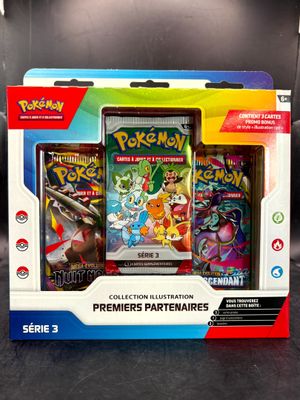 the box contains three different pokemon cards and a case of them