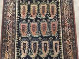 an antique persian rug with a blue and red design