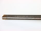 a close up of a metal pipe on a white surface