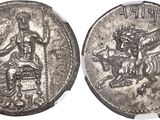 a silver coin with an image of a man on a horse