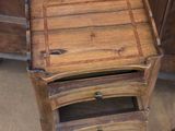 a small wooden table with a drawer on top of it
