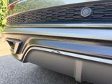 close up of the front bumper of a car with chrome trims