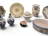 many different types of china on display on the table