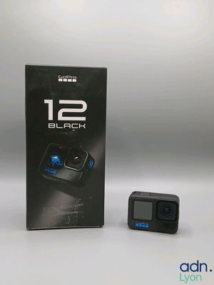 the box of the gopro camera is next to the box of the camera
