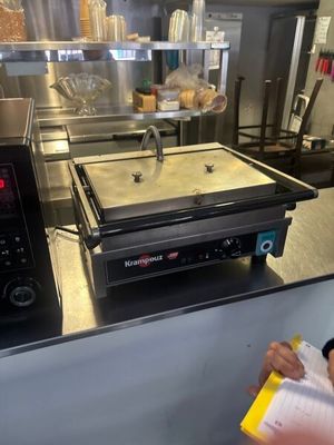 a woman that is standing in front of a counter