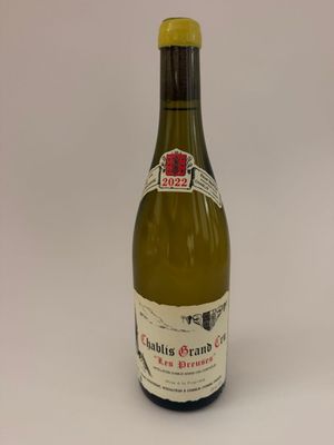 a bottle of wine that is sitting on a table