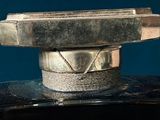 a close up of a metal object with a number on it