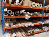 many rolls of paper on the shelves in the warehouse