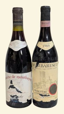 two bottles of wine sitting next to each other on a table