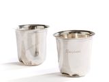pair of silverplated cups with engraved names on the sides