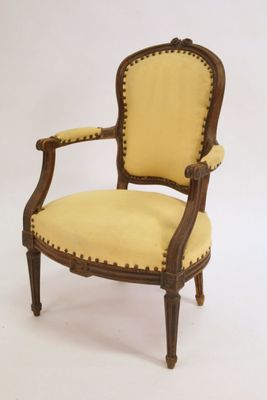 an image of a chair with a yellow upholstered seat