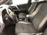 the interior of a car with a black leather seat and steering wheel