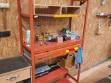 a shelf with a clock on it in a garage