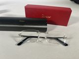 the glasses are next to a red box on the table