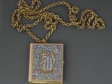 an image of a gold and silver locke with a chain around it