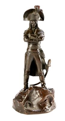 bronze statue of a man with a hat and a sword