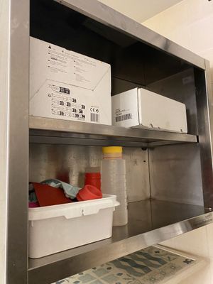 a metal shelf with a bunch of items on it