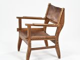 an image of a wooden chair with a brown leather seat