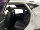 the interior of a car with the door open showing the driver ' s seat