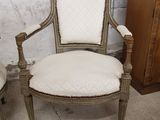 two chairs sitting next to each other in a room