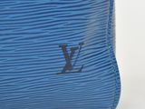 a blue louis vu vu bag on a white background