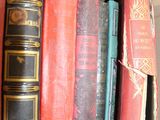 a lot of books that are sitting on a shelf