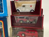 three boxed toy cars are sitting on display in a box