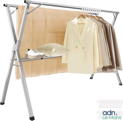 an image of a clothes rack with clothes hanging on it