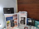 a coffee maker and a blender sitting on a counter