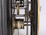 a clock that is inside of a metal case