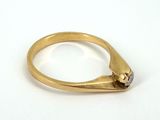 an image of a gold ring with a black diamond on it