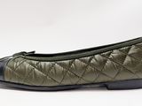 ballerinas in green and black leather with a quilted design