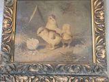 painting of two chickens and a bird in a gold frame