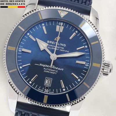 a close up of a wrist watch with a blue dial