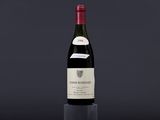 a bottle of wine sitting on top of a wooden table