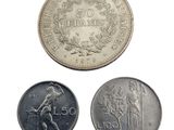 three different types of coins are shown on a white surface
