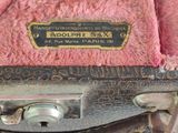 an old suitcase that has a label on it