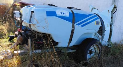 a blue and white tank sitting on the back of a truck