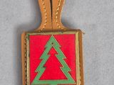 an image of a christmas tree on a red and green tag