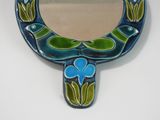 blue and green hand painted mirror with a bird and flower design