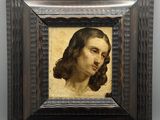 portrait d'un homme dans un cadre en bois sur fond blanc