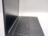 a black laptop with a black keyboard on a white surface