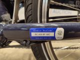 a close up of a bicycle with a blue tag on it