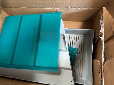 a box that has a blue lid on top of it